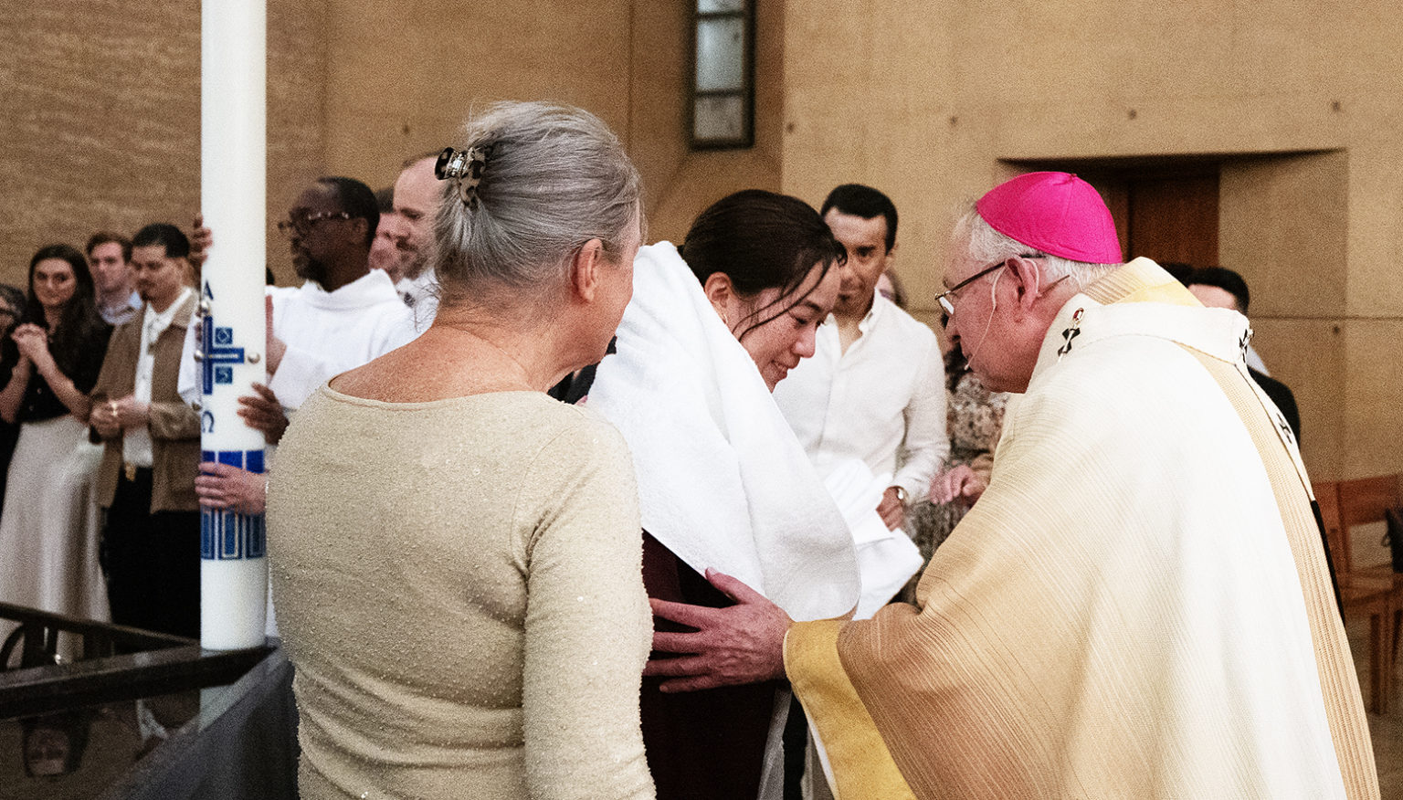 Archbishop José H. Gomez greets a newly baptized LA Catholic at the 2025 Easter Vigil at the Cathedral of Our Lady of the Angels. (Victor Alemán)